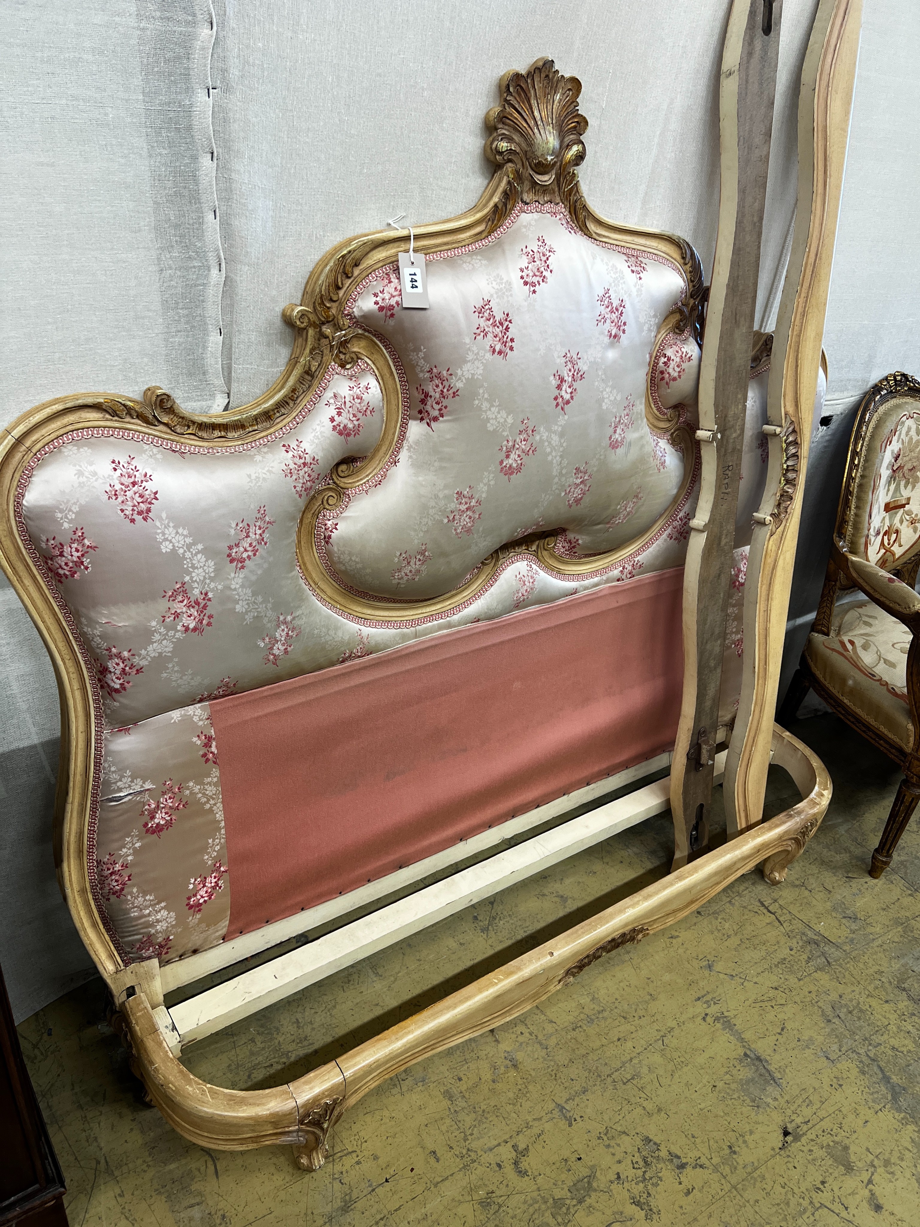 A Louis XV style satin upholstered bed frame, width 144cm, height 145cm